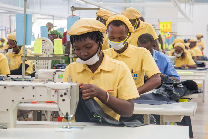 Workers at C & H Garments Ltd in Kigali's Special Economic Zone. The factory produces garments for export and local markets. / Faustin Niyigena.
