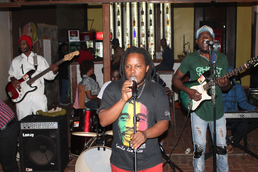 2T Reggae Man doing what he likes best, singing reggae songs to an audience. / Moses Opobo.