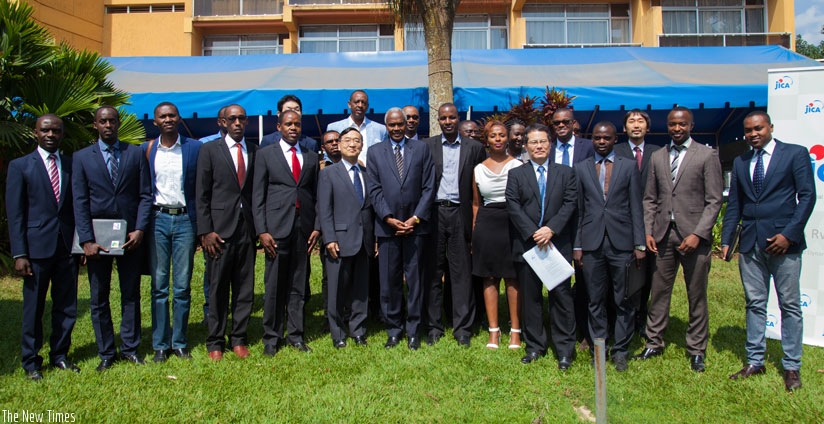 Some of the beneficiaries pose for a picture with Amb Miyashita and other embassy officials after they received their Japan student visas last week. (Nadage Imbabazi)