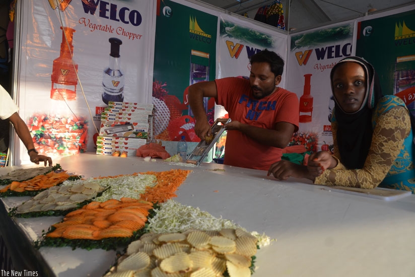 Egyptian exbitor demonstrates how to use kitchen kits at the expo. (Sam Ngendahimana.)