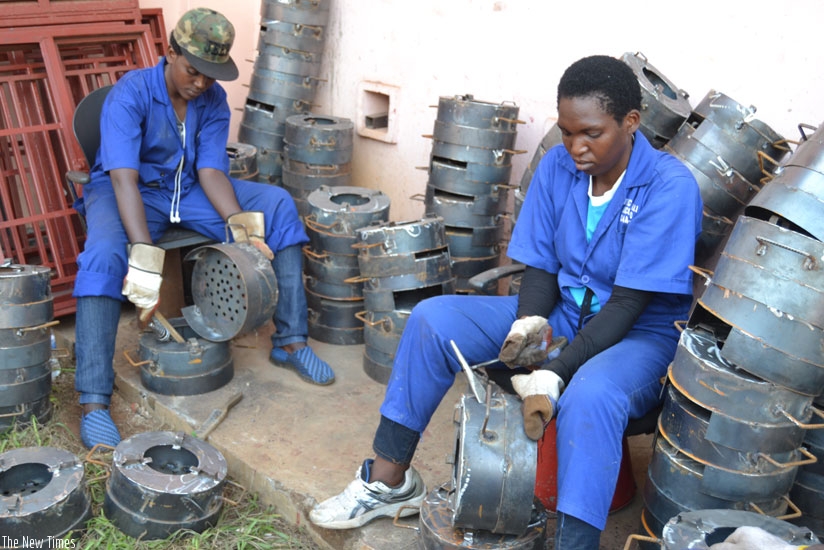Students of IPRC Kigali make energy saving cooking stoves on Wednesday. (Emmanuel Ntirenganya.)