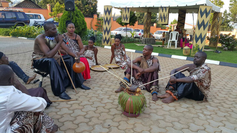 Ingyenzi, a Ugandan based Rwandan cultural  group perform a play during the Umuganura ceremony.