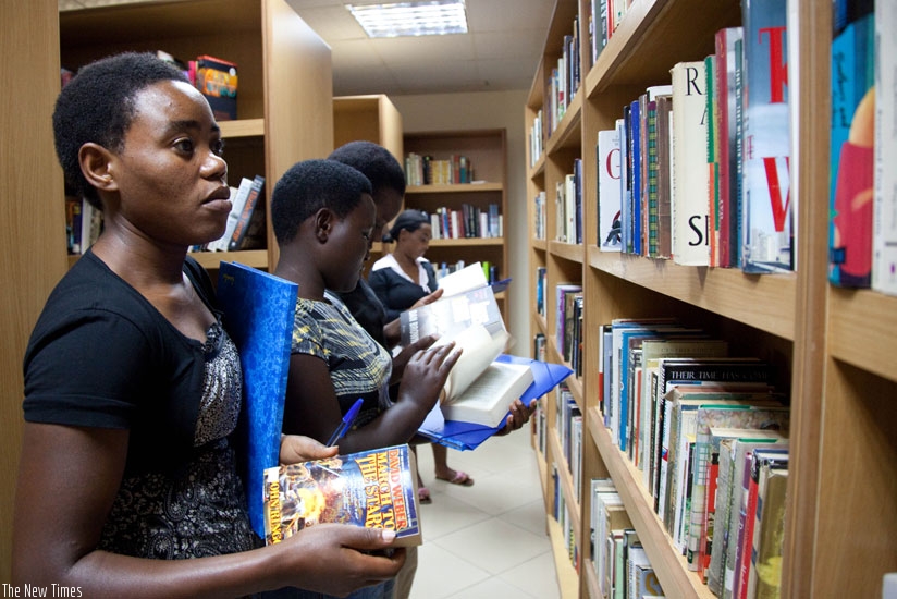 Youths search for books from shelves at Kigali Public Library. / File.