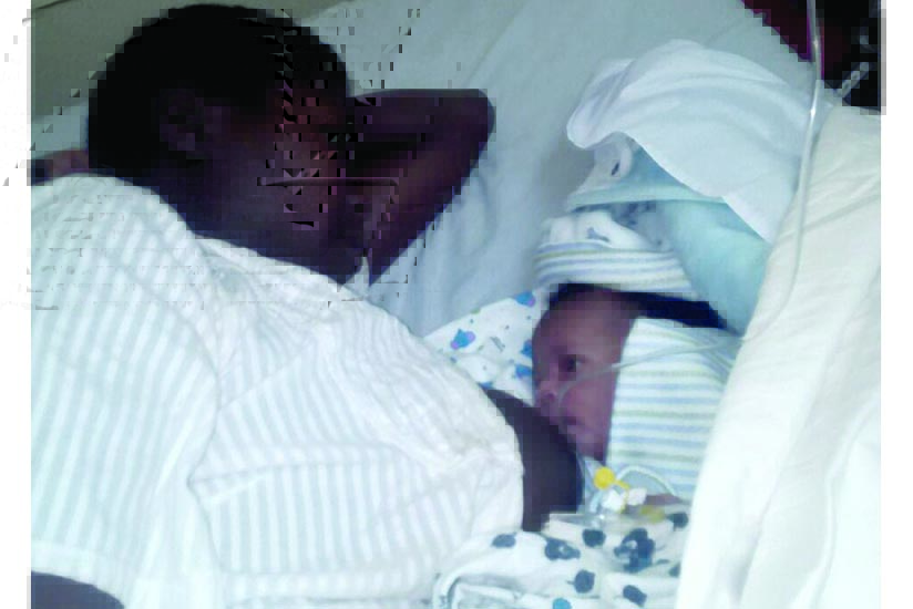 Nzamwitakuze breastfeeds her rescued baby. (Jean d'Amour Mbonyinshuti)