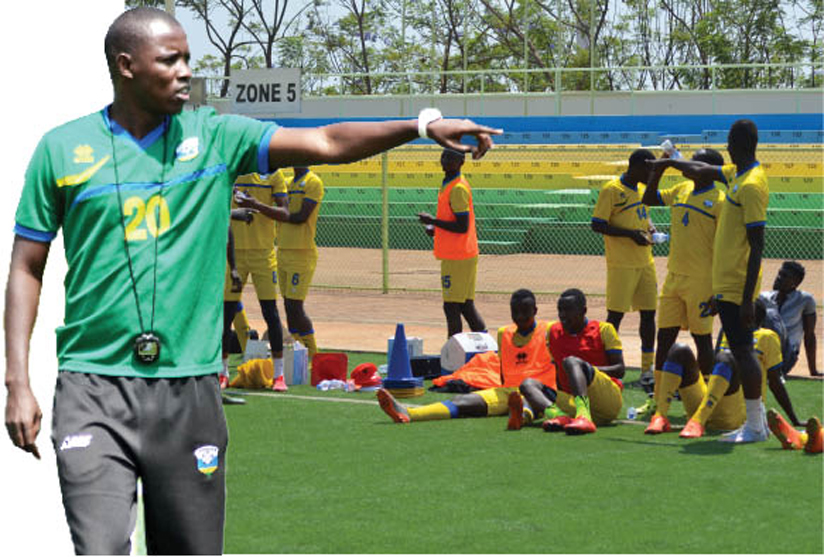 Jimmy Mulisa takes the Amavubi players through their paces at the Kigali Regional Stadium yesterday as the national team prepare for a 2017 AfCON qualifier against Ghana on Sept. 3....
