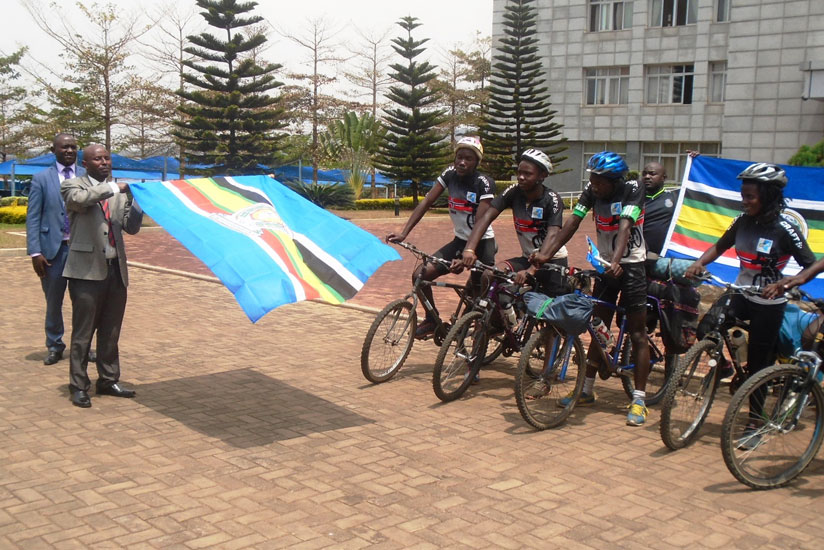 The PS in the Ministry for East African Community Affairs Innocent Safari flags off the cyclists at the ministry headquarters in Kimihurura, yesterday. / Jejje Muhinde.