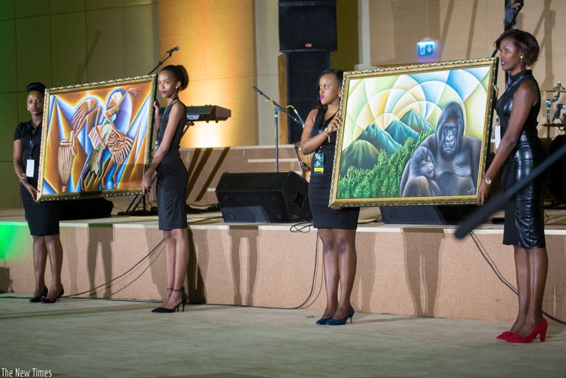 Two paintings of gorillas by artist Pascal Bushaija were auctioned at $1200 at the Kwita Izina 2016 gala dinner at Kigali Convention Center on Friday. / Faustin Niyigena.