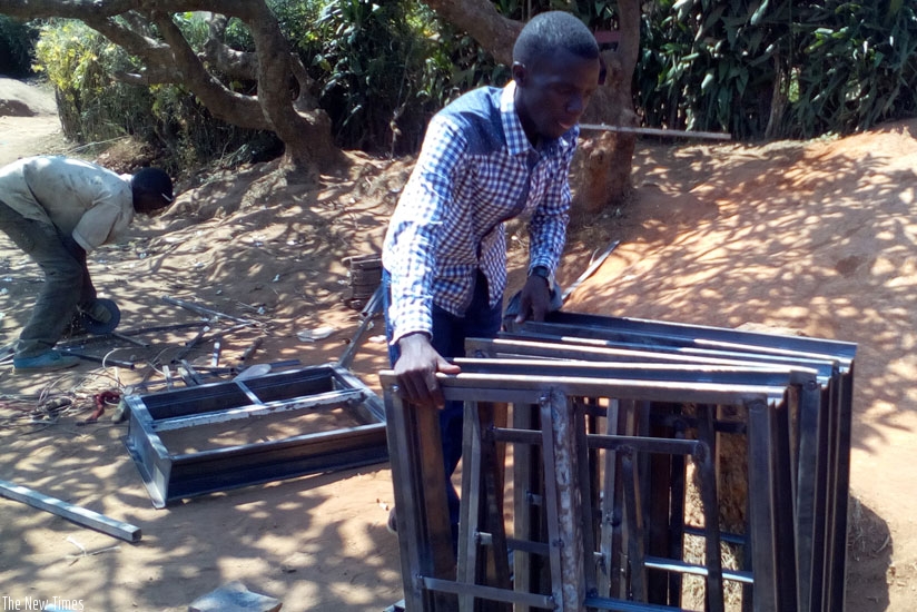 Mugera at his workshop in Kimironko. The budding entrepreneur was forced to venture into metal fabrication after failing to raise full tuition fees for university. (Lydia Atieno.)