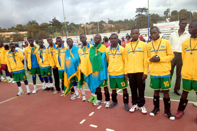 The U-18 handball team poses for a photo with their silver medals after losing to Cameroon in the final of Africa Zone 4, 5 and 6. / Courtesy.