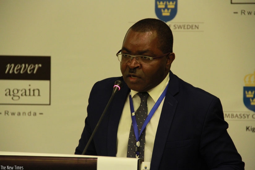 Vincent Munyeshyaka, Permanent Secreatry at the  Ministry of Local Government, adressing participants at the validation meeting