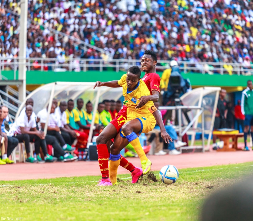 Amavubi captain Haruna Niyonzima vies for the ball with Baba Rahman of Ghana in the teams' first leg encounter which the Black Stars won 1-0 at Amahoro National Stadium in Kigali i....