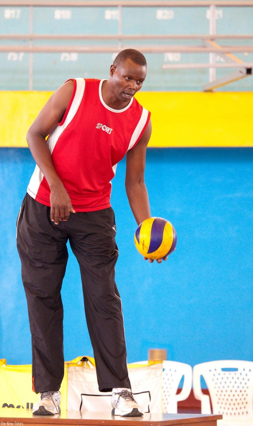 Coach Paul Bitok takes his team through training at Amahoro indoor stadium. (File)