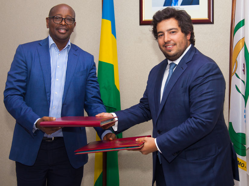 Following the Agreement signing late last night, documents were exchanged between the Minister of Infrastructure James Musoni (L)  and Mota Engil Africa Chief Manuel Mota. (Photos ....