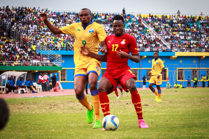 Rahman Baba of Ghana shields the ball against Rwanda's Jacques Tuyisenge during the Group H qualifier in Kigali last September. / Timothy Kisambira.