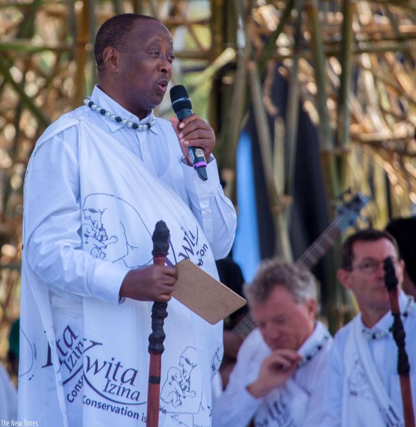 Legendary folk singer Jean-Marie Muyango naming a baby gorilla on Friday. / Faustin Niyigena