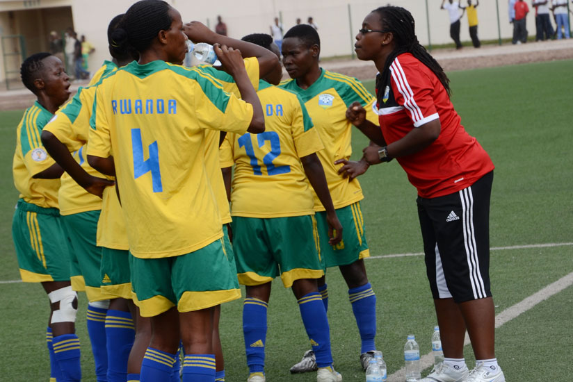 She-Amavubi head coach Grace Nyinawumuntu gives instructions to her players during the clash against Nigeria on May 24, 2014 at Umuganda Stadium. / File.