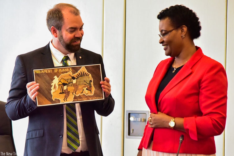Fredrik Lundh Sammeli, a representative of Swedish parliament, receives a gift from Speaker Mukabalisa after the meeting. / Nadege Imbabazi.