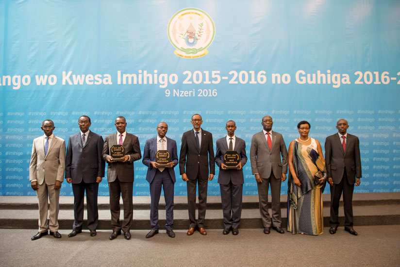 President Kagame in a group photo with local leaders whose districts shone in the Imihigo for 2015/16 and other government officials yesterday. During the meeting at Kigali Confere....