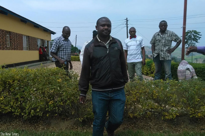 Sinayobye with his employees at COOTHEGIM cooperative head quarters in Karongi District. (Photos by P Tumwebaze)