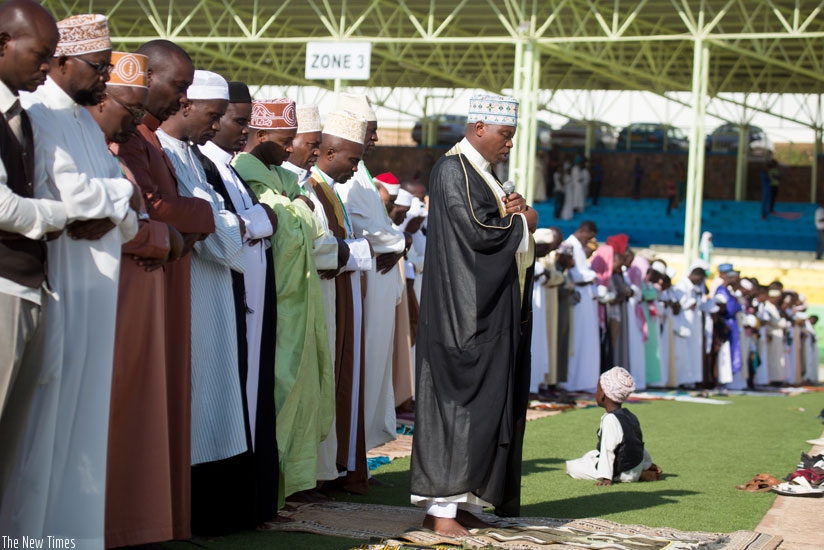 Sheikh Salim Hitimana, the mufti of Rwanda, leads Eid-al-Adha prayers at Nyamirambo Regional Stadium yesterday. The mufti urged Muslims to distance themselves from terror acts and ....