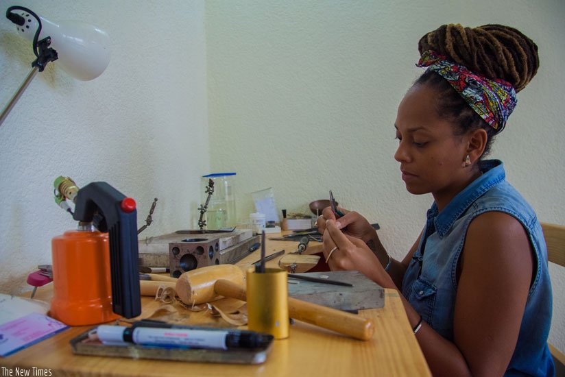 Sarafina Legrand, founder of K-Tsobe, in her jewelry workshop in Kigali. (Photos by Faustin Niyigena)
