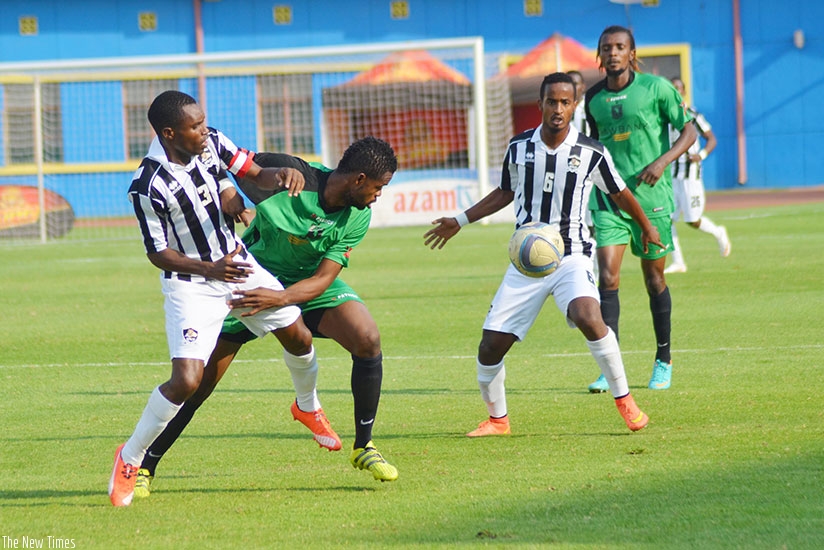 APR captain Albert Ngabo and midfielder Yannick Mukunzi in action during the final against AS Vita Club on Saturday. / Sam Ngendahimana.