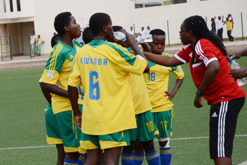 Coach Grace Nyinawumuntu talks to her players during a past match. / File