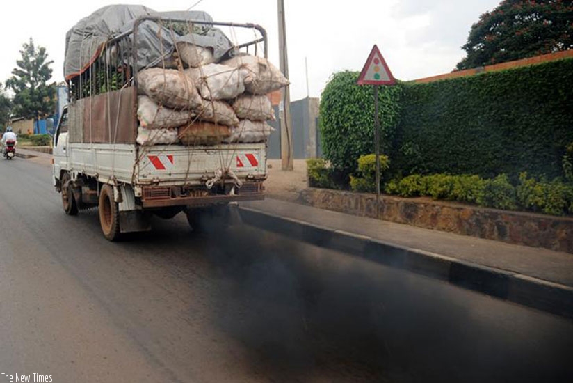 Fumes belch from a vehicle on Kanombe-Remera road. High-sulphur fuels can permanently damage emission-reducing technologies in cars, experts say. (File)