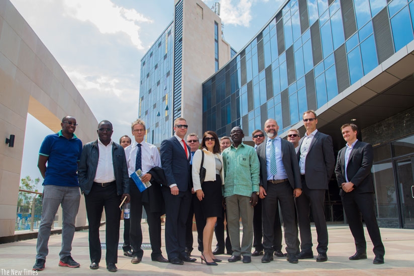 Investors and officials of the Kigali Heights Complex pose for a group photo after a guided tour of the building. The facility will house big retail brands and banking institutions....