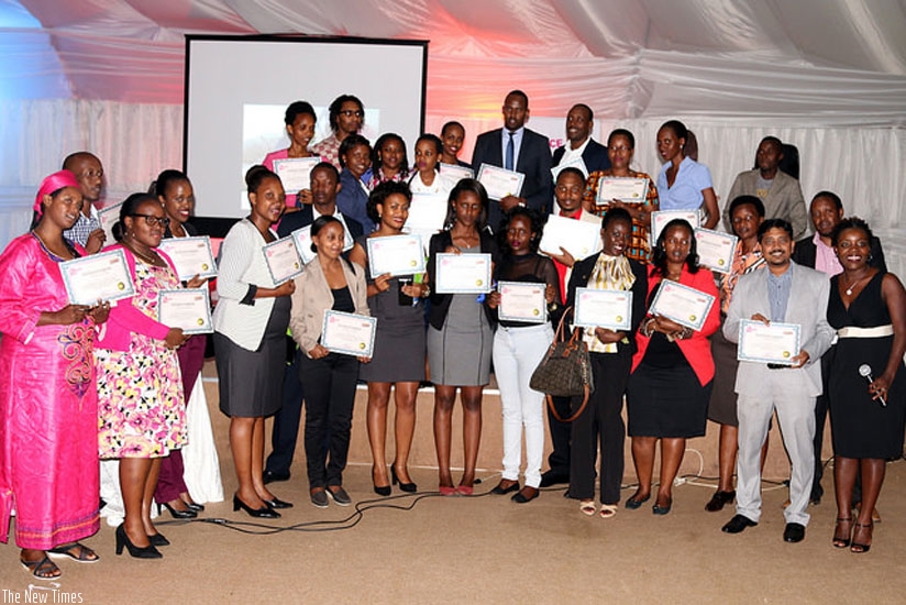 The writer (extreme right) poses with some of workers and managers who were awarded for excellence customer service last year. (Courtesy photo.)
