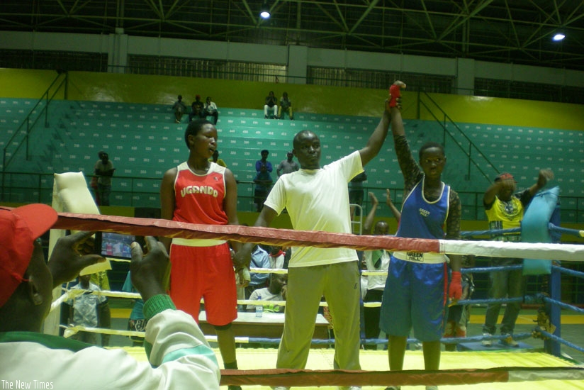 The referee pronounces Cecile Umubyeyi the winner of her fight against Hanifah Nandujja in the only girls bout of the tournament. S. Kalimba