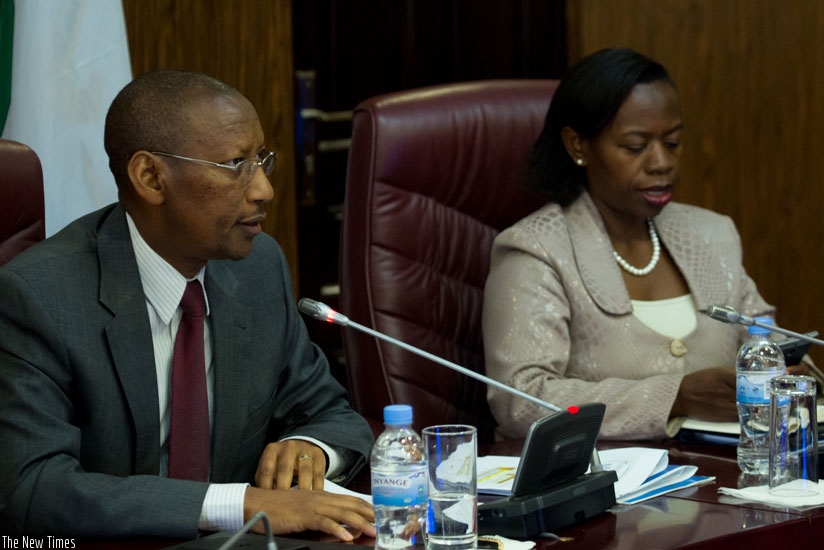 Rwangombwa (L) and vice governor Monique Nsazabaganwa at the news briefing yesterday. / Timothy Kisambira