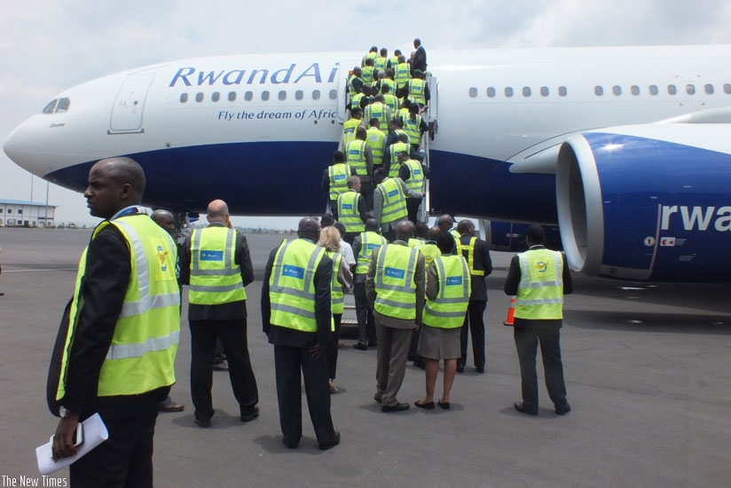 RwandAir staff and other public officials board Airbus A330-200 (named Ubumwe) for an interior tour on Wednesday. (Courtesy.)