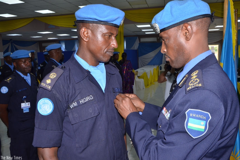 UNMISS Police Commissioner, Commissioner of Police (CP) Bruce Munyambo decorates Senior Supt. Willy Marcel Higiro during the ceremony on Wednesday. (Courtesy.)