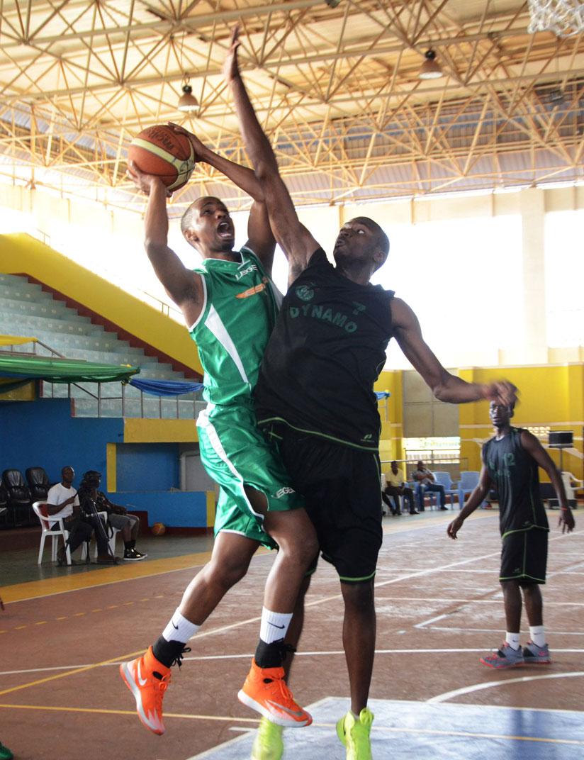 A Dynamo player tries to block Lionel Hakizimana from shooting during last year's Zone V Club Championships. / Sam Ngendahimana.