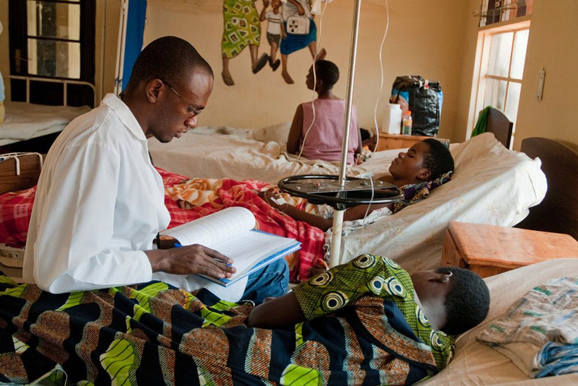 A medic attends to a patient in one of the hospitals