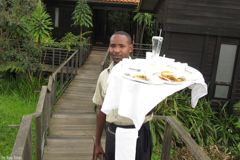 A waiter at Nyungwe Forest Lodge. The annual Customer Service Week is a time to celebrate workers and clients. (File photo.)