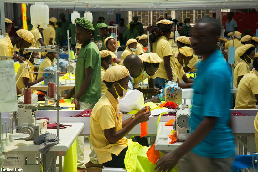 Workers at the C&H garments factory that recently opened shop in Kigali. A World Bank report has attributed Rwanda's economic stability to the growth in private sector. / File