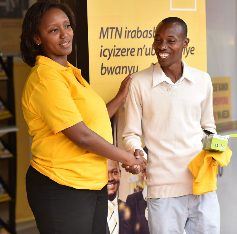 Makolo hands over prizes to a lucky winner during the launch. / Courtesy.