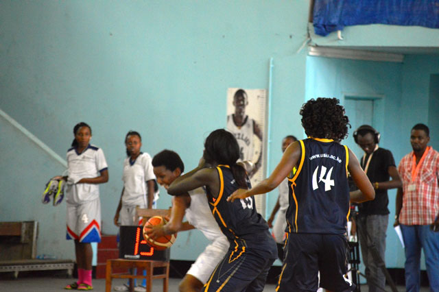 Ubumwe's shooting guard faces a tough challenge from USIU players as she tries to go for a shoot during yesterday's game. / Geoffrey Asiimwe