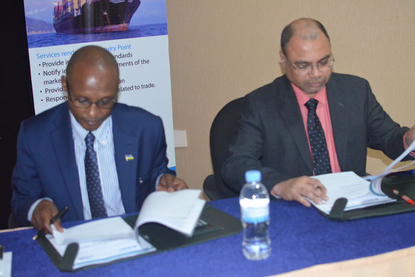 Chandrasekaran (R) and Dr Cyubahiro Bagabe sign the MoU in Kigali.
