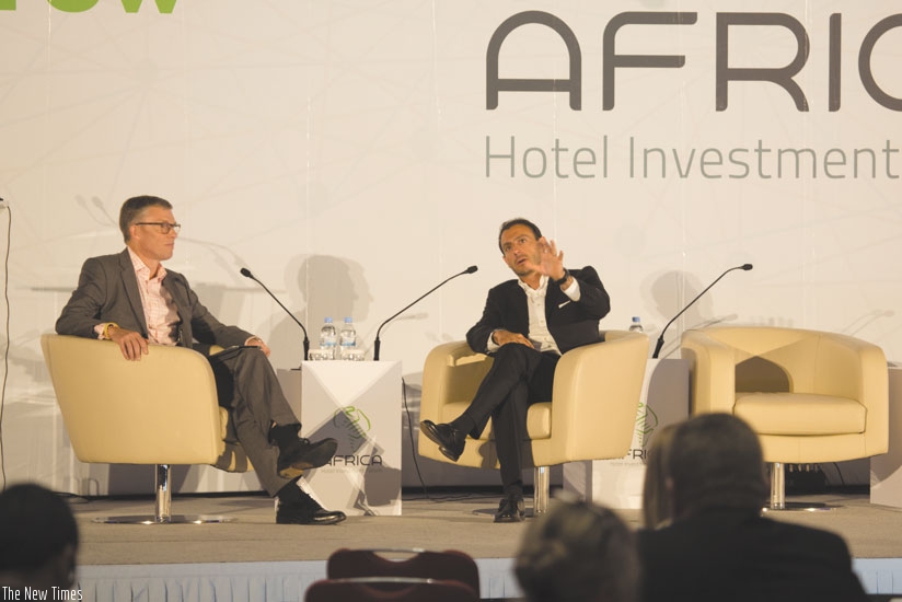 Jonathan Hubbard ((L), head of Investor Services EMEA Hotels and Hospitality, interviews Elie Younes during the meeting in Kigali. (Timothy Kisambira.)