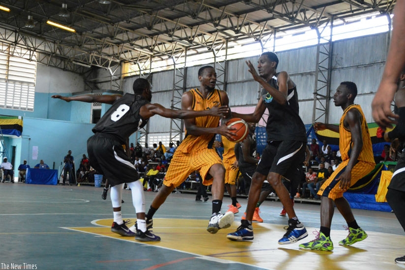 Patriots captain Ali Kubwimana, #8, and Jean de Dieu Ntaganduka try to stop ISIU player as he tries to go for a basket. The two sides meet again today in the 3rd place playoff. / G....