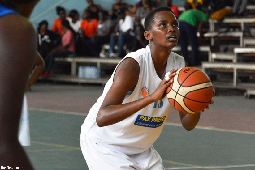 Ubumwe shooting guard Ines Nezerwa goes for a lay-up during their match with UCU on Thursday. rn(G. Asiimwe.)