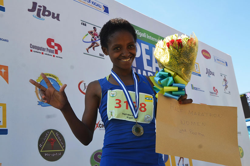 Salome Nyirarukundo celebrates her second position in Half Marathon on May 22, 2016. / Sam Ngendahimana