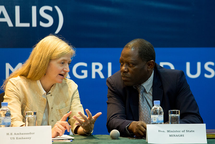 State Minister for Agriculture Fulgence Nsengiyumva listens to US Ambassador to Rwanda Erica J. Barks-Ruggles at the launch of the Agriculture Land Information System in  Kigali ye....