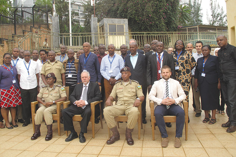 Cuttat (2nd left) and Rwigamba (2nd right) pose for a group photo with Rwanda Correctional Service staff at the opening of the training at Galaxy Hotel in Kiyovu. / Donata Kiiza