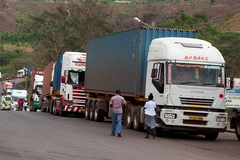 Cargo trucks enter Rwanda at Rusumo. EAC business leaders are calling for unlimited movement of goods and labour. / File