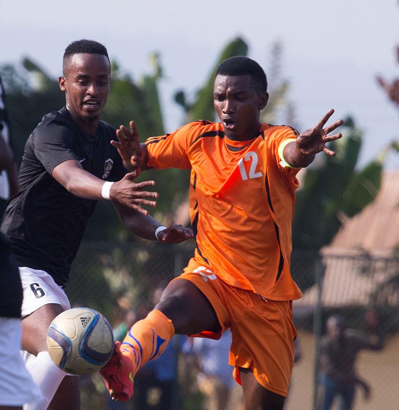 Bugesera FC forward David Nzabanita controls the ball under pressure from APR midfielder Yannick Mukunzi last season. / Timothy Kisambira