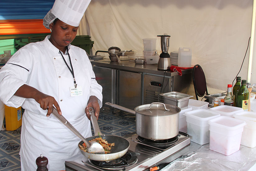 A cook prepares a meal at a hotel in Kigali. / File
